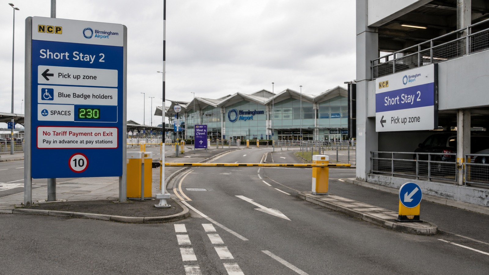 Birmingham Airport BHX short-stay car park pickup zone with the terminal building visible in the background