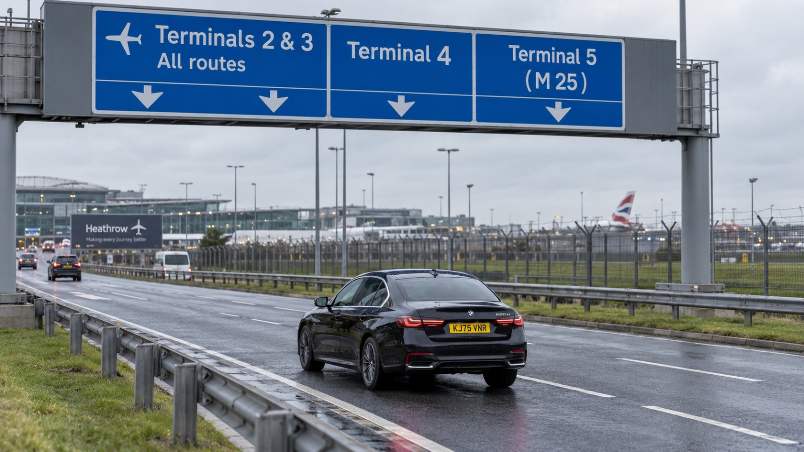 Overhead direction signs on the Heathrow approach road showing Terminals 2, 3, 4 and 5